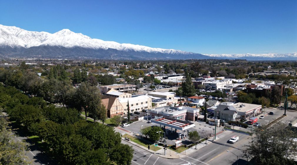 Aerial view of Historic downtown Upland with blue sky and snow-capped mountains