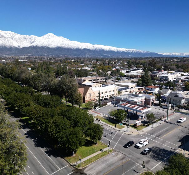 Aerial view of Historic downtown Upland with blue sky and snow-capped mountains